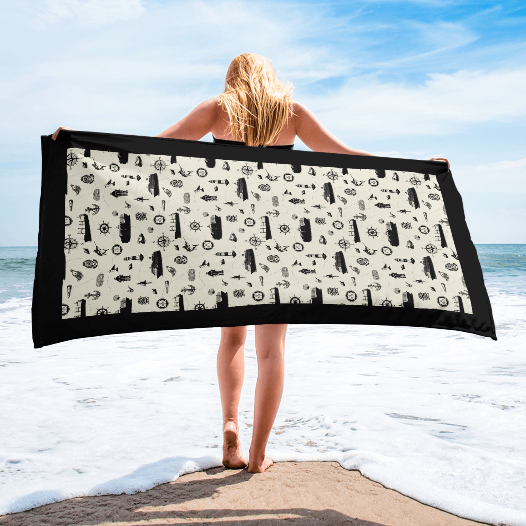 Luxury cruise ship beach towel design on the beach with a cruise ship crew member