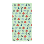 Children's towel with nautical pattern on a light green background