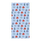 Baby blanket with nautical pattern on a light blue background