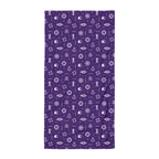 Purple towel with white maritime-themed icons on a white background