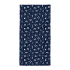 Navy blue towel with white maritime pattern on a white background
