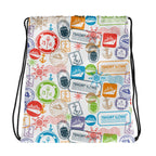 Drawstring bag with colorful stamp-like designs on a white background