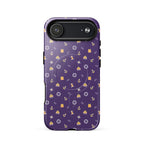 Purple phone case with a pattern of anchors and other nautical symbols on a white background