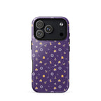 Purple phone case with a pattern of anchors and other nautical symbols on a white background