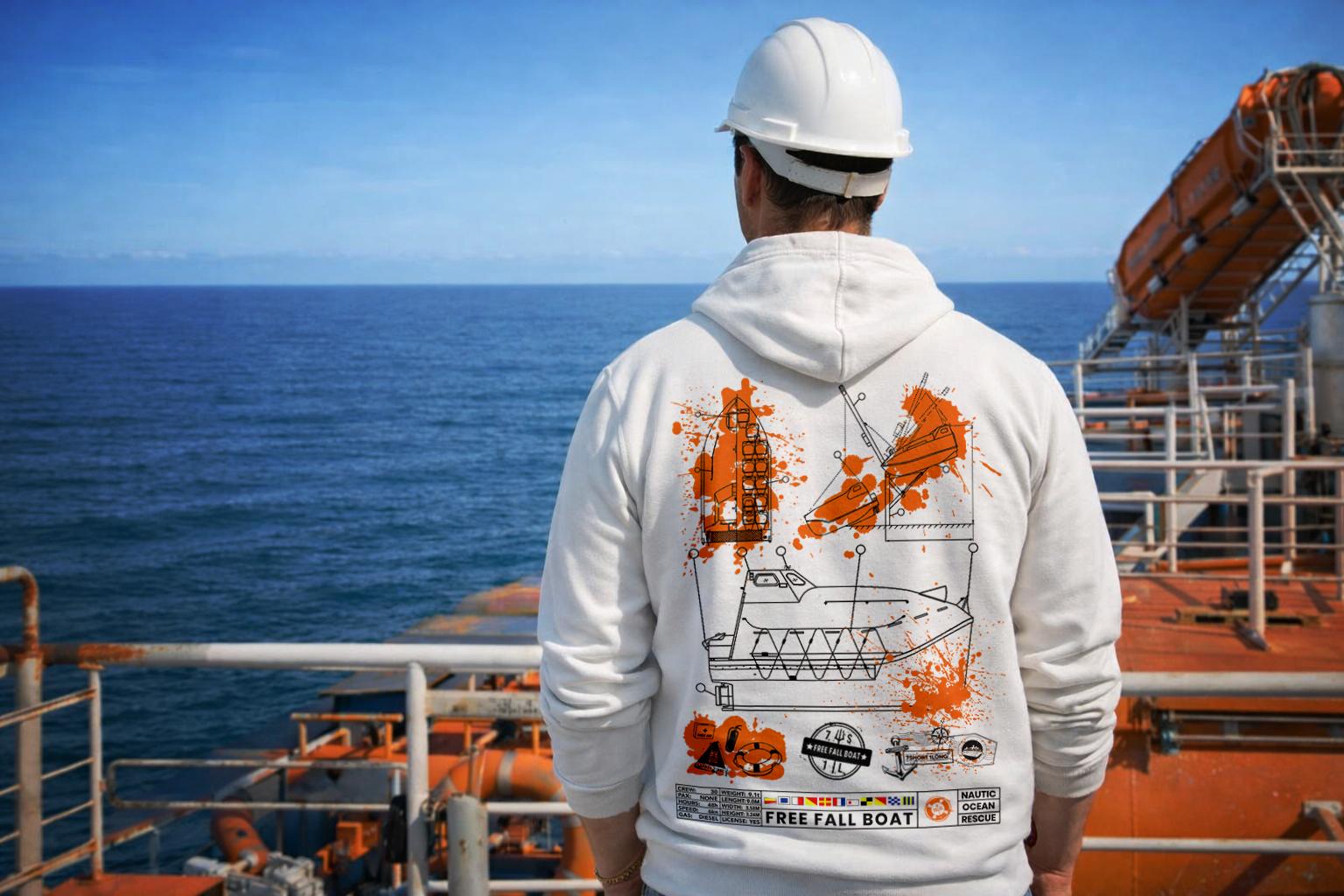 Sailor stay on the deck of a vessel wearing a hoodie with maritime pattern in the background is a life boat